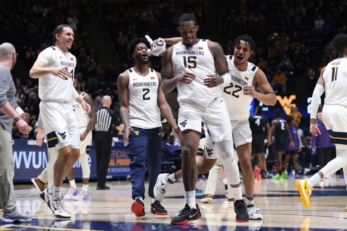 West Virginia players celebrate during the first half of the team's NCAA college basketball game against TCU on Wednesday, Jan. 18, 2023, in Morgantown, W.Va